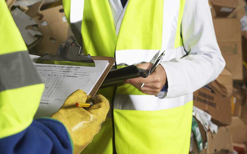 Tree surgeon clipboard checklist with hi vis jackets